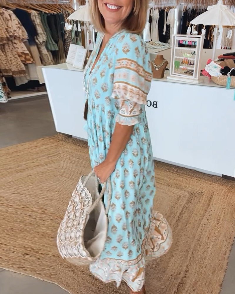 MANA | CHIQUE BLOEMEN MIDI-JURK MET V-HALS