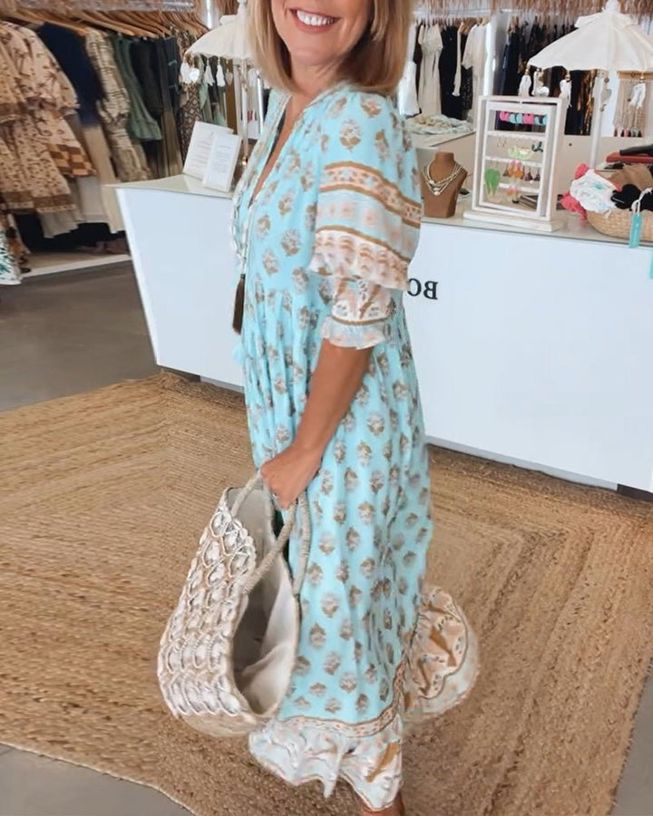 MANA | CHIQUE BLOEMEN MIDI-JURK MET V-HALS