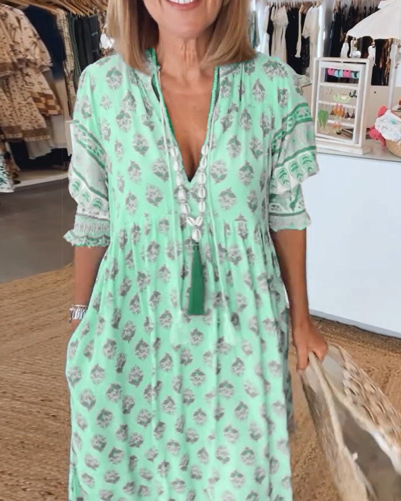 MANA | CHIQUE BLOEMEN MIDI-JURK MET V-HALS