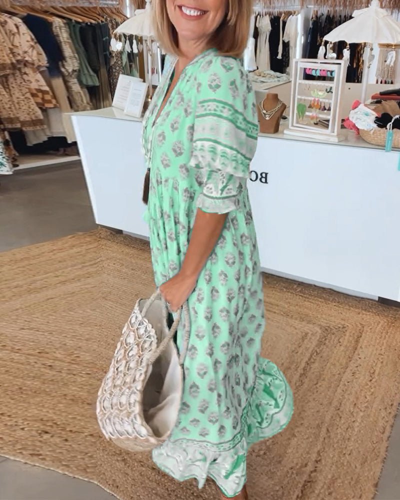 MANA | CHIQUE BLOEMEN MIDI-JURK MET V-HALS